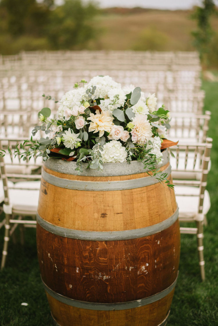 flowers on barrel ceremony setup neutral wedding - Loudoun County wedding Lisa Havard Events