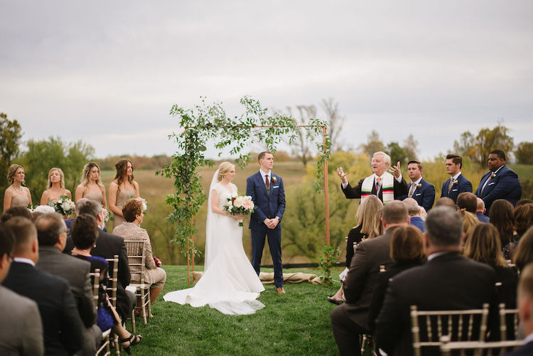 outdoor ceremony simple copper and greenery backdrop neutral wedding - Loudoun County wedding Lisa Havard Events