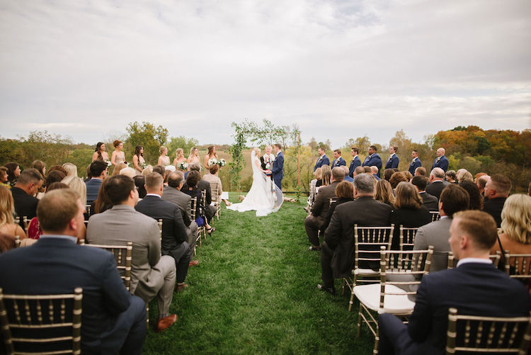 outdoor ceremony simple copper and greenery backdrop neutral wedding - Loudoun County wedding Lisa Havard Events