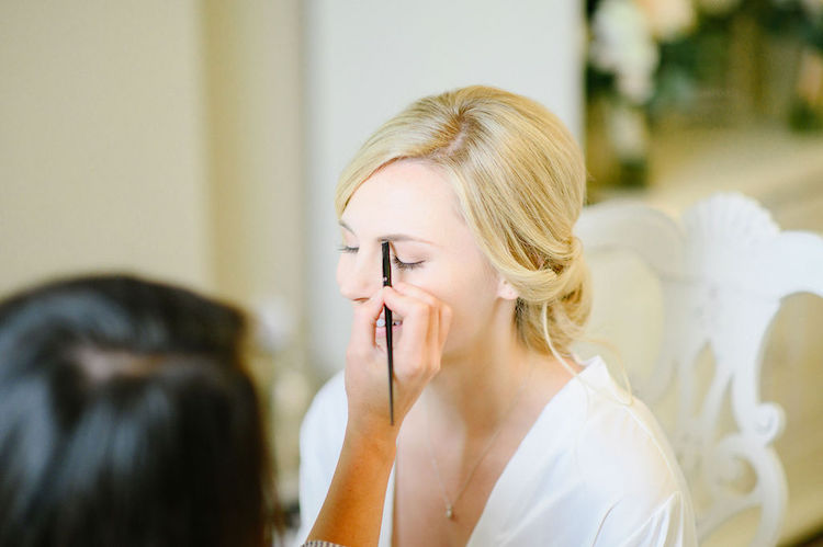 bride getting makeup done - Loudoun County wedding Lisa Havard Events