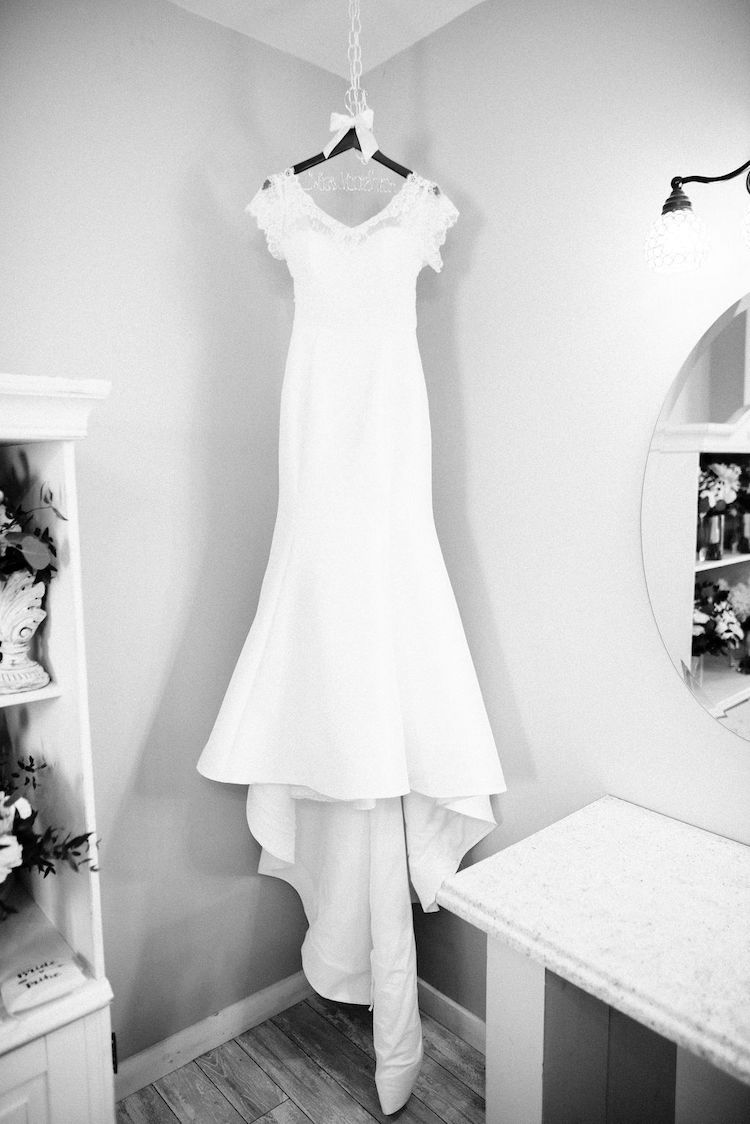 short sleeve wedding dress on hanger - Loudoun County wedding Lisa Havard Events