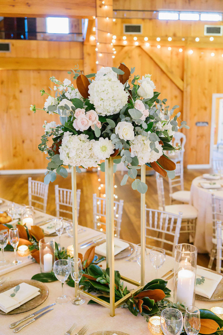 elevated floral centerpiece and magnolia garland table decor - Loudoun County wedding Lisa Havard Events
