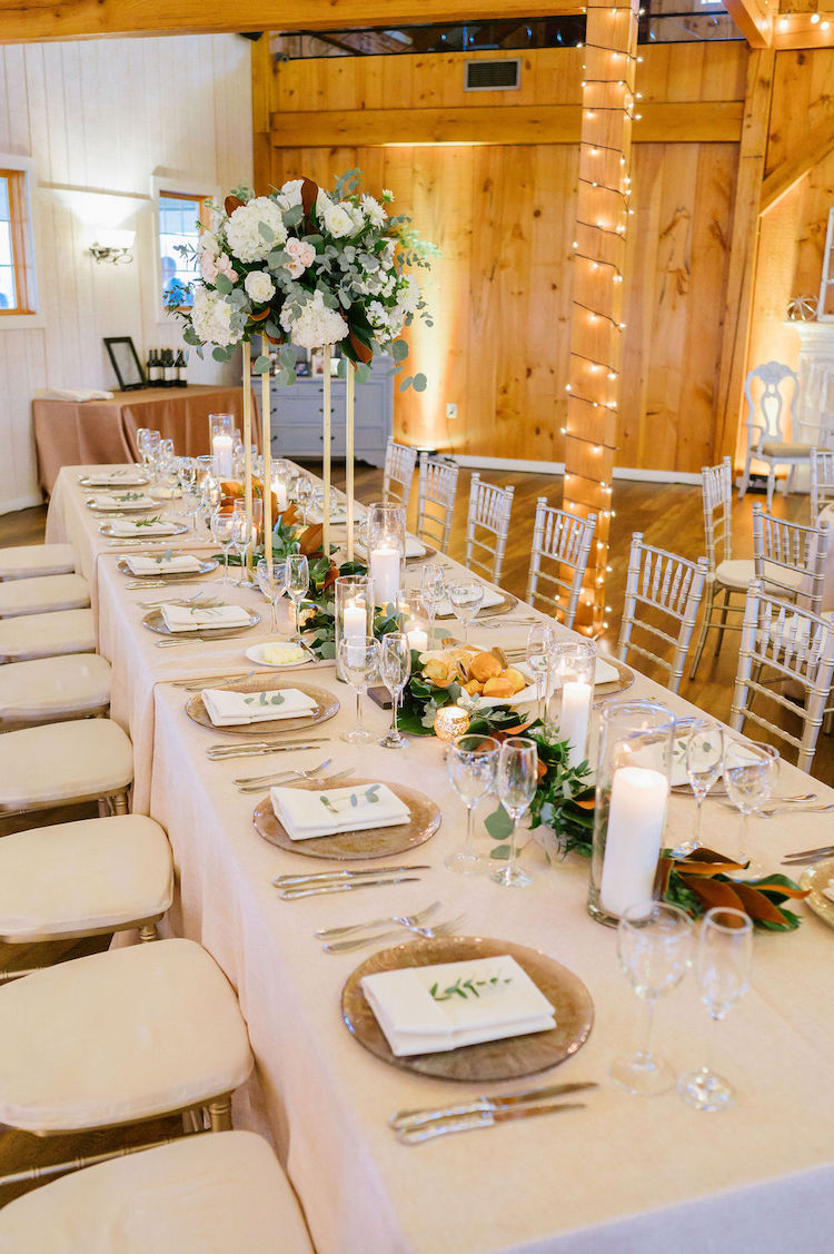 light, bright barn reception setup with beige tables and silver chairs neutral wedding - Loudoun County wedding Lisa Havard Events